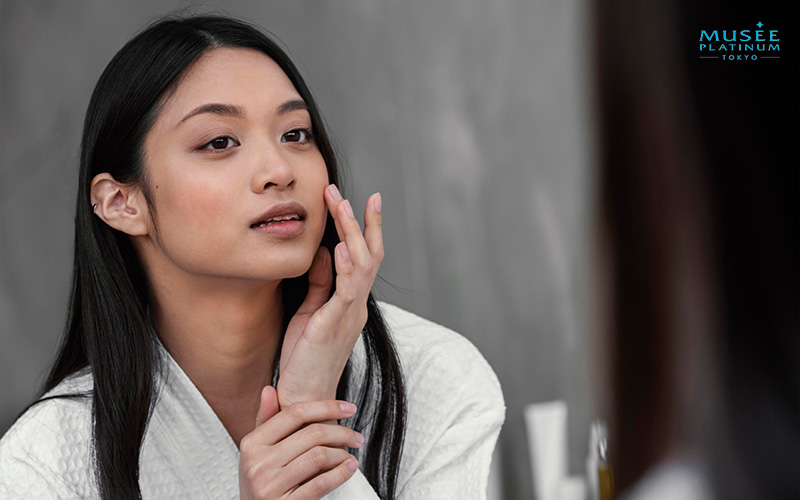 Women Checking Her Skin for Acne
